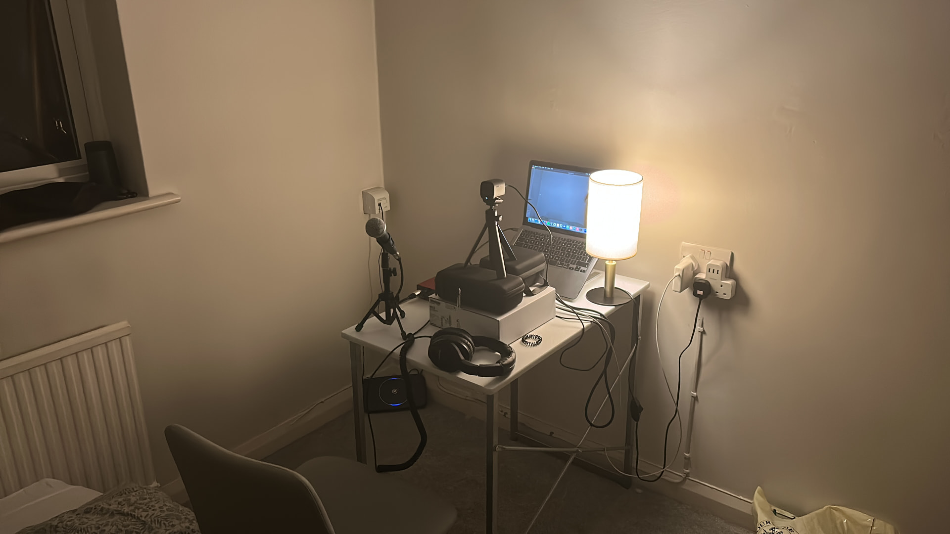 Hugo Harvey's interview setup with microphone, laptop and lamp